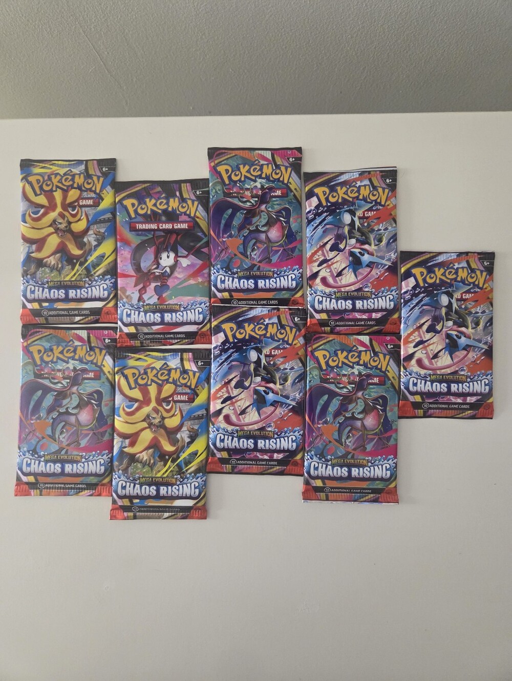Pokémon Mega Evolution- Chaos Rising Booster Pack (English) - 9 Packs